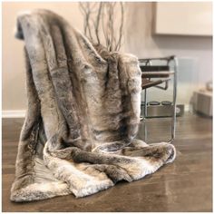 a chair with a fur blanket on top of it