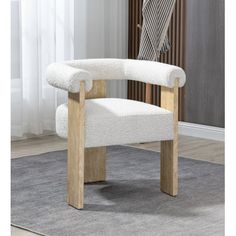 a white chair sitting on top of a carpeted floor next to a wooden frame