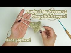 two hands holding yarn and crochet with the text, magic mushroom v2 chapstick lanyard free pattern