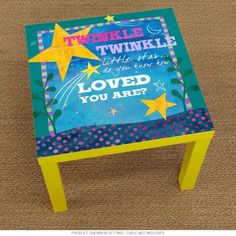 a small table with a quote on it that says, twinkle the stars are loved you are?