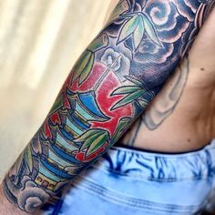 a man with a tattoo on his arm