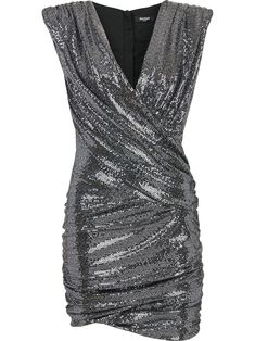 Silver wrap sleeveless mini dress from Balmain featuring V-neck, ruched detailing, asymmetric hem, rear zip fastening and sleeveless. | Balmain Wrap Sleeveless Mini Dress Short Cocktail Dress Parties Fancy, Silver Night Dresses, Silver Dresses Formal Short, Black Silvery Dress, Georgina Sparks, Png Outfits, Sequin Short Dress, Balmain Clothing, Mid Skirt