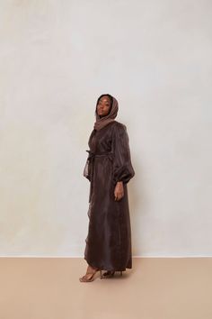 The Organza Abaya is statement outfit for any event. It's super lightweight yet so simple with the prettiest sheen. Complete the look with our matching long sleeve satin slip dress and a pair of strappy heels for a luxe finish or make it into a more casual look. Model is wearing a size Small Model Measurements: Height 5'8. Waist 25", Bust 32", Hips 37" *Please note that the color displayed in the picture might be slightly different due to the color resolution and lighting. Fabric Description & C Elegant Silk Maxi Abaya, Silk Maxi Abaya For Eid, Silk Abaya For Eid Party, Eid Party Silk Abaya, Silk Long Abaya For Eid, Silk Long Abaya For Party, Long Silk Abaya For Eid, Elegant Silk Abaya For Eid, Silk Party Abaya