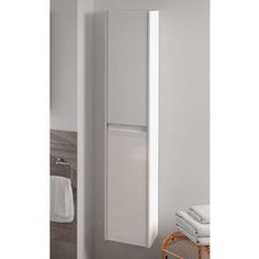 a bathroom with a white cabinet and towel rack