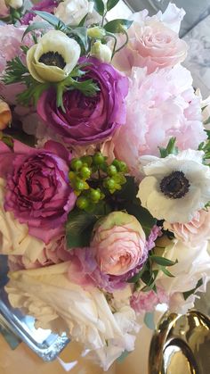 a bouquet of flowers sitting on top of a table