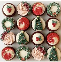 twelve cupcakes decorated with christmas decorations on top of each other, all in different shapes and colors