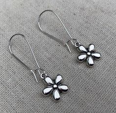 "These sweet and dainty flower dangle earrings might be little in design but they are eye catching and timeless. The perfect everyday earrings for any nature lover. Perfect for Spring and Summer! The earrings measure 3/8\" long by 3/8\" wide and are made from plated silver. They hang from kidney style ear wires that lock and latch. Overall drop length is 1 3/8\". I have a matching necklace in my shop, if you would like the whole set. Here is a direct link Thanks for stopping by! Please take a mo Spring Flower Charm Earrings For Everyday, Dainty Nickel-free Flower Earrings For Everyday, Everyday Pierced Flower Drop Earrings, Pierced Drop Flower Earrings For Everyday, Dainty Silver Earrings For Spring, Sterling Silver Drop Earrings For Spring, Spring Nickel Free Drop Flower Earrings, Spring Teardrop Flower Earrings For Pierced Ears, Everyday Flower Earrings With Spring Charm