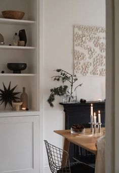 a dining room table with candles on it