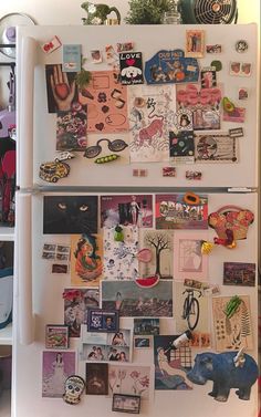 a refrigerator covered in magnets and pictures