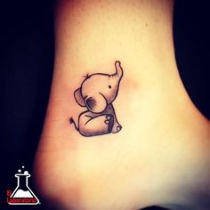 a small elephant tattoo on the ankle