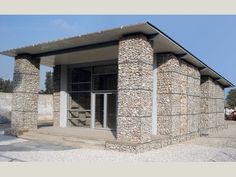 an old stone building with doors and windows