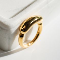 TUBE ∙ GOLD ∙ RING Embrace minimalist sophistication with our 18K Gold Tube Ring, a chic statement piece designed to elevate your jewelry game. The handcrafted design features a unique tube style in 18K gold plated stainless steel, offering a touch of understated elegance to your everyday attire. ✓ 18K Gold Plated ✓ Stainless Steel - Tarnish-Free, Waterproof ✓ Comfort Fit Design - Perfect for Layering & Solo Wear 📸 Refer to our ring size chart in the last photo before ordering. Save more with our offer: Buy 2 or more items and get 60% off! 💖 EXPLORE * MORE https://easyjewl.etsy.com With your continued support, we keep doing what we love every day. Our deepest gratitude 💫 -------------------------------------------- SHIPPING & RETURNS: We strive to offer FREE shipping to most countries w Modern Yellow Gold Wide Band Ring For Everyday, Gold Minimalist Dome Ring For Everyday, Minimalist Gold Wide Band Ring For Everyday, Minimalist Dome Ring With Open Band For Promise, Minimalist Dome Ring With Open Band As Promise Ring, Modern Yellow Gold Midi Rings With Thick Band, Gold Minimalist Stackable Rings With Polished Finish, Minimalist Wide Band Open Ring Tarnish Resistant, Minimalist Wide Band Open Ring, Tarnish Resistant