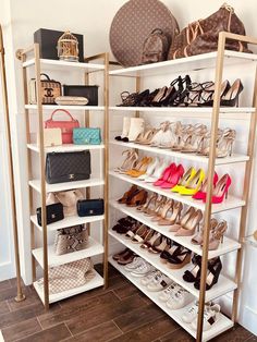 there are many shoes and purses on the shelves