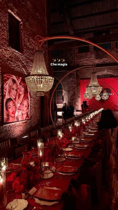 a long table is set with candles and place settings for people to sit at it