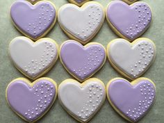 heart shaped cookies with white and purple icing