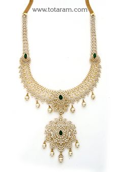 18 karat gold 'detachable - 4 in 1' diamond long necklace with color stones & south sea pearls
    it can be used as a short necklace
  this product has a detachable pendant which can be used as a separate pendant with most chains.
  this product has inter changeable stones in the necklace and pendant.
   length of the short necklace without pendant & back chain : 8.00 inches 
  length of the pendant : 3.50 inches
  width of the pendant : 2.15 inches    

introducing our exquisite 18 karat gold Dazzling Gold Emerald Necklace For Wedding, Dazzling Hand Set Gold Emerald Necklace, Gold Diamond Necklace With Detachable Pendant For Wedding, Traditional Gold Emerald Necklace With Diamonds, Hand Set Yellow Gold Emerald Necklace For Wedding, Gold Emerald Necklace With Intricate Design For Reception, Gold Diamond Necklace With Stone Work, Traditional Gold Diamond Necklace With Stone Work, Yellow Gold Diamond Jewelry With Stone Work