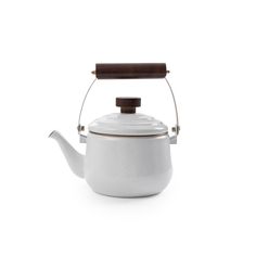 a white tea pot with a wooden handle and lid on a white background, the kettle is shaped like a teapot