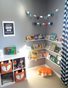 a child's room with bookshelves and toys