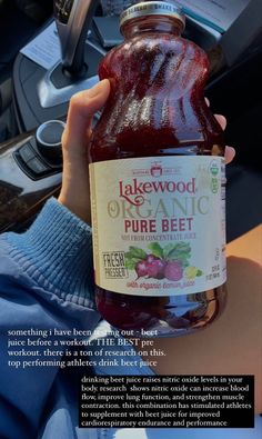 a person holding up a bottle of organic beet juice in their hand, with the caption above it