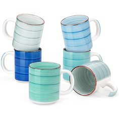 four different colored mugs sitting next to each other