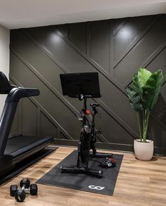 there is a bike and exercise equipment in the room