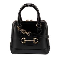 Gucci Top Handle Bag By Alessandro Michele Black Leather 1955 Horsebit Accent Gold-Tone Hardware Rolled Handles & Single Adjustable Shoulder Strap Leather Trim Embellishment Canvas Lining & Single Interior Pocket Zip Closure At Top Protective Feet At Base Includes Dust Bag Details Estimated Item Measurements Shoulder Strap Drop: 20.75" Handle Drop: 3.25" Height: 7.25" Width: 8" Depth: 3" Item # Guc1478957 Gucci Monogram Bag, Gucci Top Handle Bag, Gucci Monogram, Alessandro Michele, Leather Trims, Leather Straps, Dust Bag, Shoulder Strap, Top Handle Bag