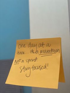 a yellow sticky note attached to the side of a door that says, one day at a time irish mauvemen not a spirit stay focused