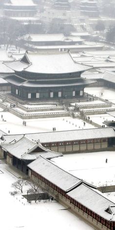 an aerial view of the forbidden city in winter