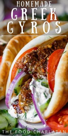 two pita breads filled with meat and vegetables on top of a white plate