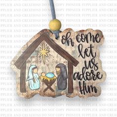 a wooden ornament with a nativity scene and the words, oh come let us adore him