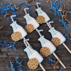 six cookie shaped cupcake toppers on sticks