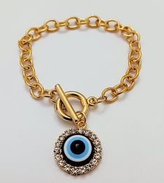 Evil Eye With Gold Chain Bracelets Gift Metal Chain Bracelet, Metal Charm Bracelet With Evil Eye, Metal Charm Bracelet With Evil Eye For Gift, Evil Eye Metal Charm Bracelet, Metal Chain Bangle Bracelet With Charms, Adjustable Metal Charm Bracelet With Chain, Trendy Metal Charm Bracelet Round, Trendy Metal Charm Bracelet, Trendy Round Metal Charm Bracelet