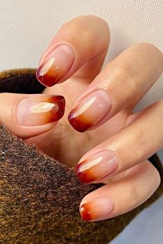 Add a touch of chic to your nails with this fall ombre manicure. Perfect for any occasion, these ideas are sure to impress. Pin to your "Chic Nails" board and read the article for more gorgeous designs. Fall Ombre Nails, Ombre Nail Colors, Orange Ombre Nails, Ombre Gel Nails, Red Ombre Nails, Fall Ombre, Ombre Manicure, September Nails, Fall Manicure