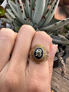 "This size 7 Vintage Class Ring. This vintage class ring is from Shelby High School in 1944 and is a 10kt gold estate ring. With the letter \"S' boldly pronounced it really shows off its vintage class ring qualities. The initials MJB are engraved on the inside and underneath the ring, the bezel has been loved and is slightly damaged(view photo above). However, this signet upcycled ring does fit comfortably and is ready to be loved for many more timeless years to come. All of our rings are sent in a beautiful ring box and are unpolished unless otherwise requested.  In addition, inquire about re-sizing.  As a third generation jeweler, my passion for vintage, antique and estate jewelry is why Timeless Estate Jewelry exists. I love seeing jewelry lovers cherish these timeless pieces and give t Upcycled Rings, High School Rings, School Rings, Class Rings, Estate Ring, Estate Rings, View Photo, Ring Antique, Star Top