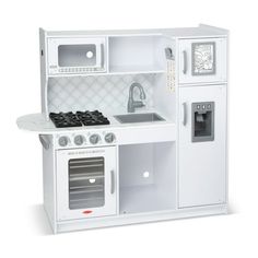 a white toy kitchen with stove, sink and oven