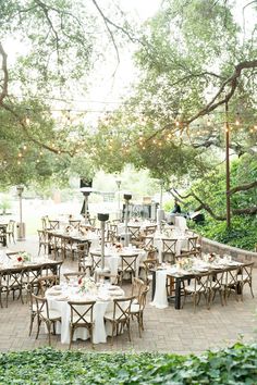 tables and chairs set up for an outdoor wedding reception