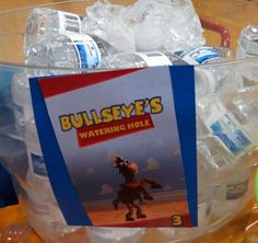 a plastic bucket filled with lots of water and bottled drinks on top of a table