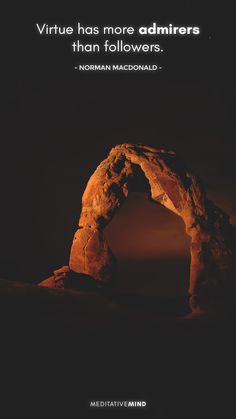 an arch in the desert with a quote on it