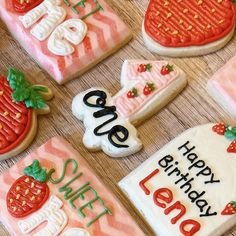 decorated cookies with the words sweet sixteen and strawberry shortcakes on them are displayed