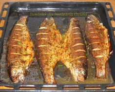 three fish are being cooked in a pan on the stove top and ready to be eaten