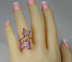 "JEWELRY STORE RETAIL: $3,950 ULTRA FEMININE & FUN 18K BY PASS BUTTERFLY RING!! If you love nature & butterflies you will Love these girls!!. Mother & baby shaded rubies & pink sapphires wings with white diamonds. Their bodies are also bright white diamonds. They flow gracefully on a by pass design, adding to the elegance of these pretty girls. Their just the right size to attract attention yet easy to wear all day. Listing is for ring only. Earrings shown listed separate. NOTE- Pink Butterfly Ring For Wedding, Pink Fine Jewelry Butterfly Ring As Gift, Elegant Pink Butterfly Ring For Wedding, By Pass Ring, Diamond Butterfly, Ring Ruby, Green Garnet, Bypass Ring, All Gems