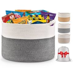 a large white and grey basket with candy in it next to two drawsacks