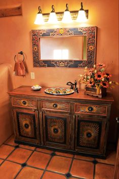 a bathroom with a sink and mirror in it