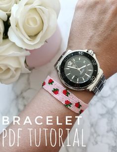 a woman's wrist with a watch and flowers