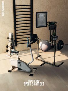 an exercise room with two stationary bikes and a wall mounted towel rack in the corner