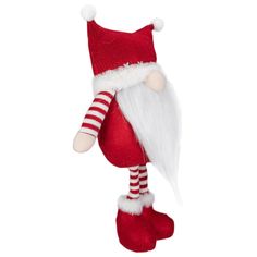 a red and white santa claus doll hanging from the ceiling