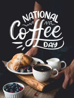 the national coffee day poster is displayed on a table with two cups of coffee and croissants