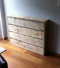 a wooden dresser sitting on top of a hard wood floor