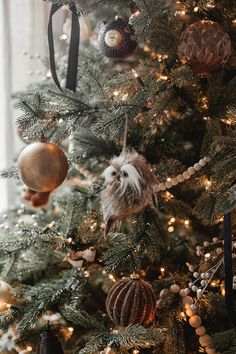 a christmas tree with ornaments hanging from it