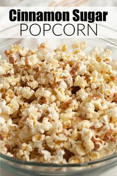 a glass bowl filled with popcorn and the words cinnamon sugar popcorn on top of it